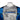Close-up of a gray and blue high-performance boating shirt with the 'Blazer Boats' logo across the chest.